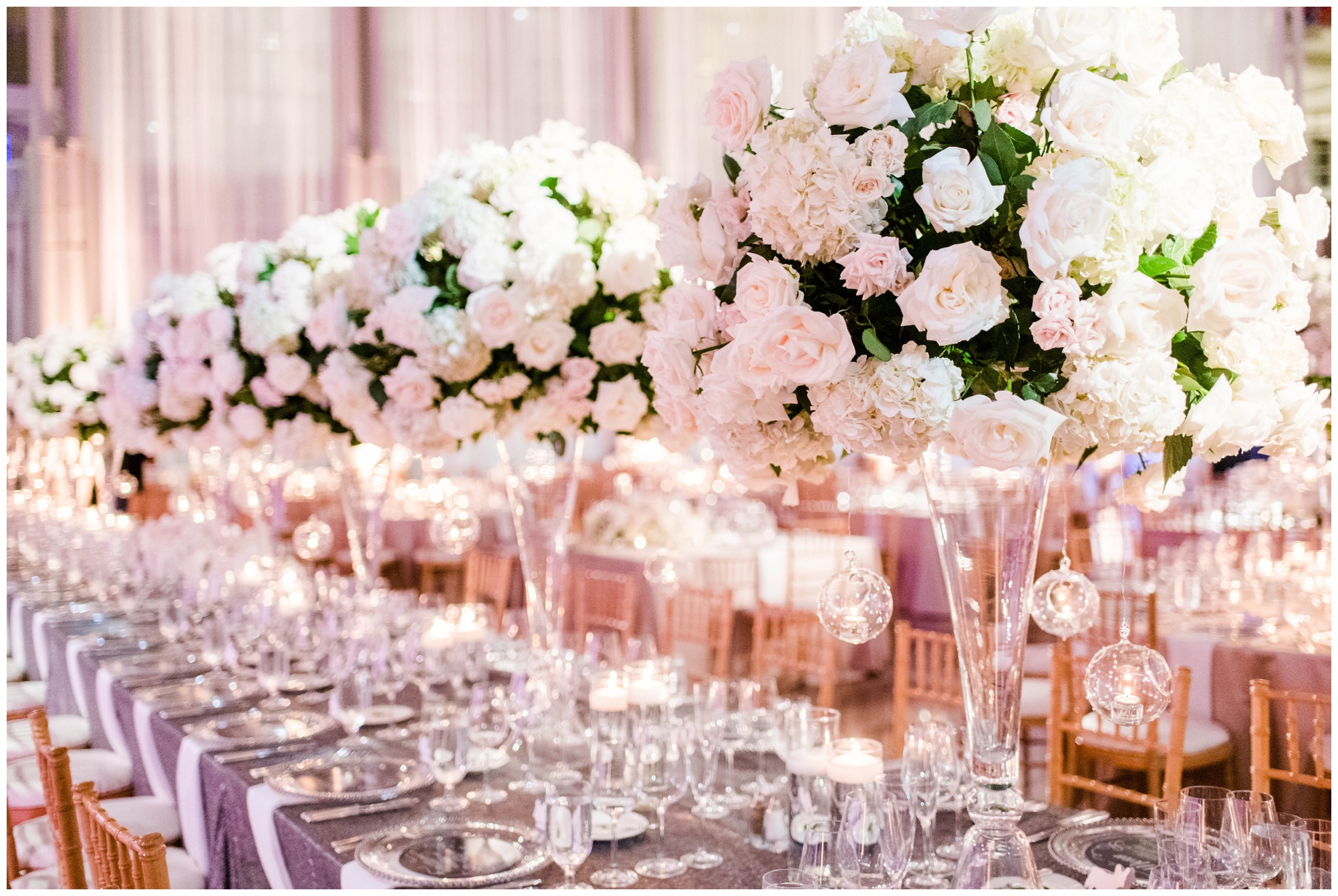 Gorgeous downtown DC wedding, towering florals and sparkly centerpieces at Ronald Reagan Building.