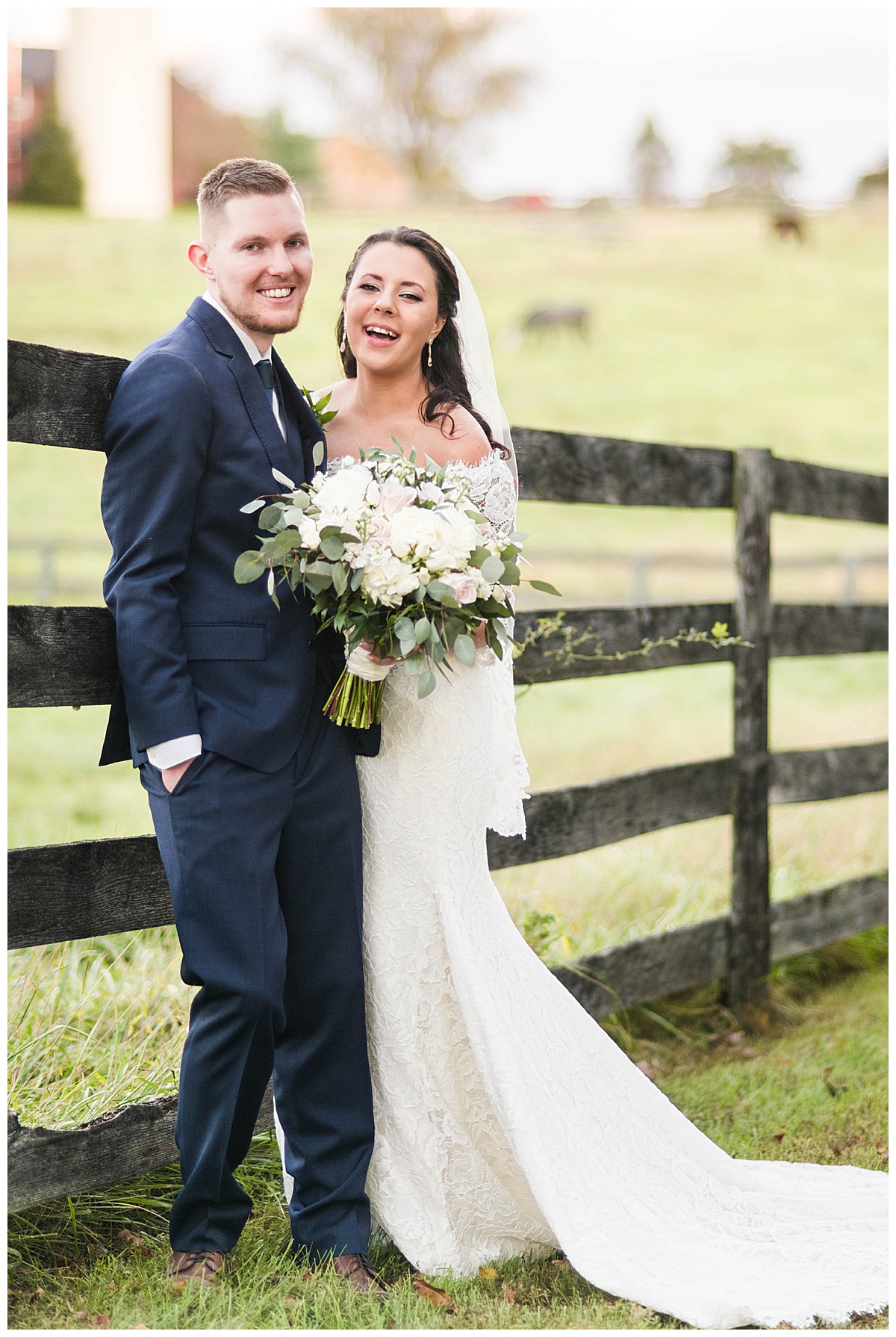8 Chains North Winery Wedding: bride and groom, laughing, outdoors, white wedding dress with veil, navy grooms suite, fence