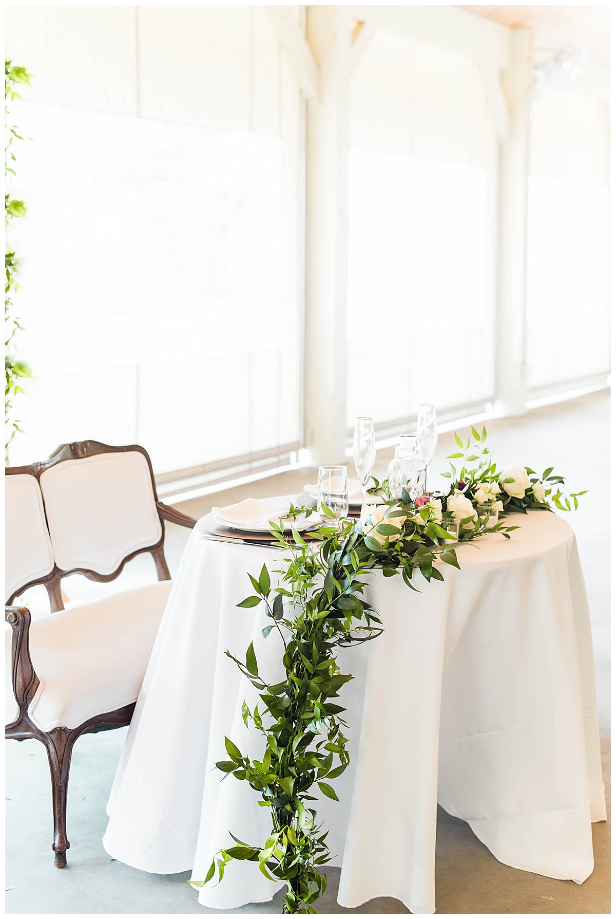 Wood Grain and Greenery Seven Springs Farm Wedding: Sweetheart Table and Wedding Reception Details