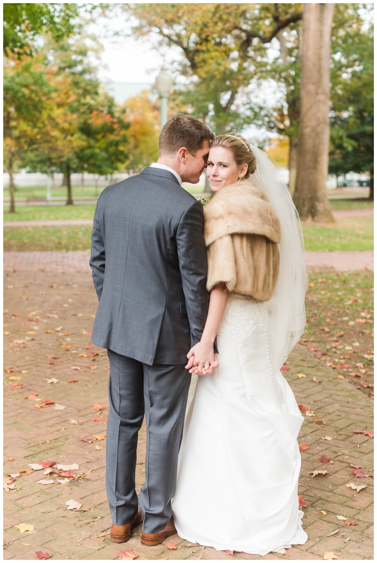 united states naval academy wedding veil bride and groom portrait fur coat bridal 