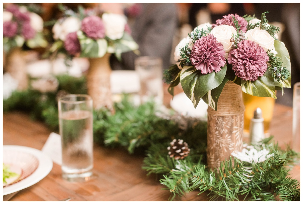 garden party inspired mill at fine creek wedding venue december wedding reception details forest inspired fabric flowers wood table centerpiece