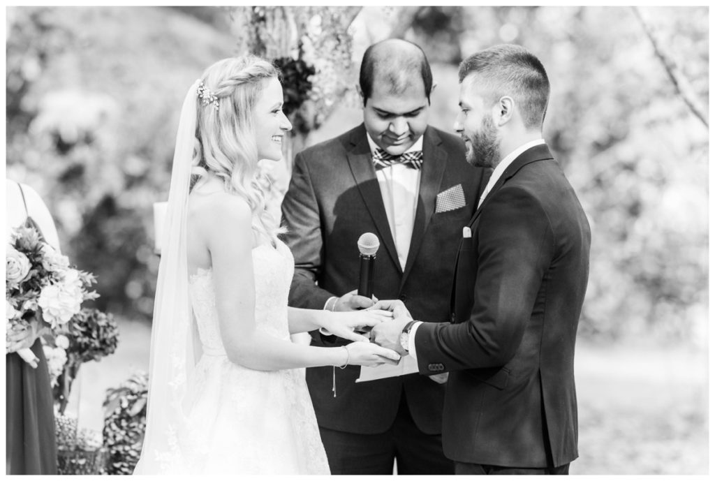 rustic vintage inspired wedding Charlottesville B & B fall Wedding vintage rustic wedding decor bride and groom holding hands black and white photo