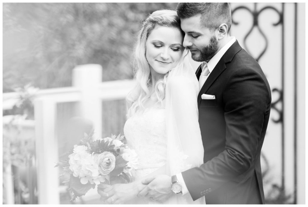 rustic vintage inspired wedding Charlottesville B & B fall Wedding  bride and groom outdoors in garden black and white photo