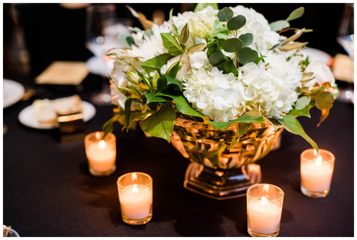 classic new years eve wedding richmond virginia table scape flower centerpieces with candles inspiration rva wedding venue redskins training center events rva wedding photographer black and gold new years eve place setting inspiration floral centerpieces
