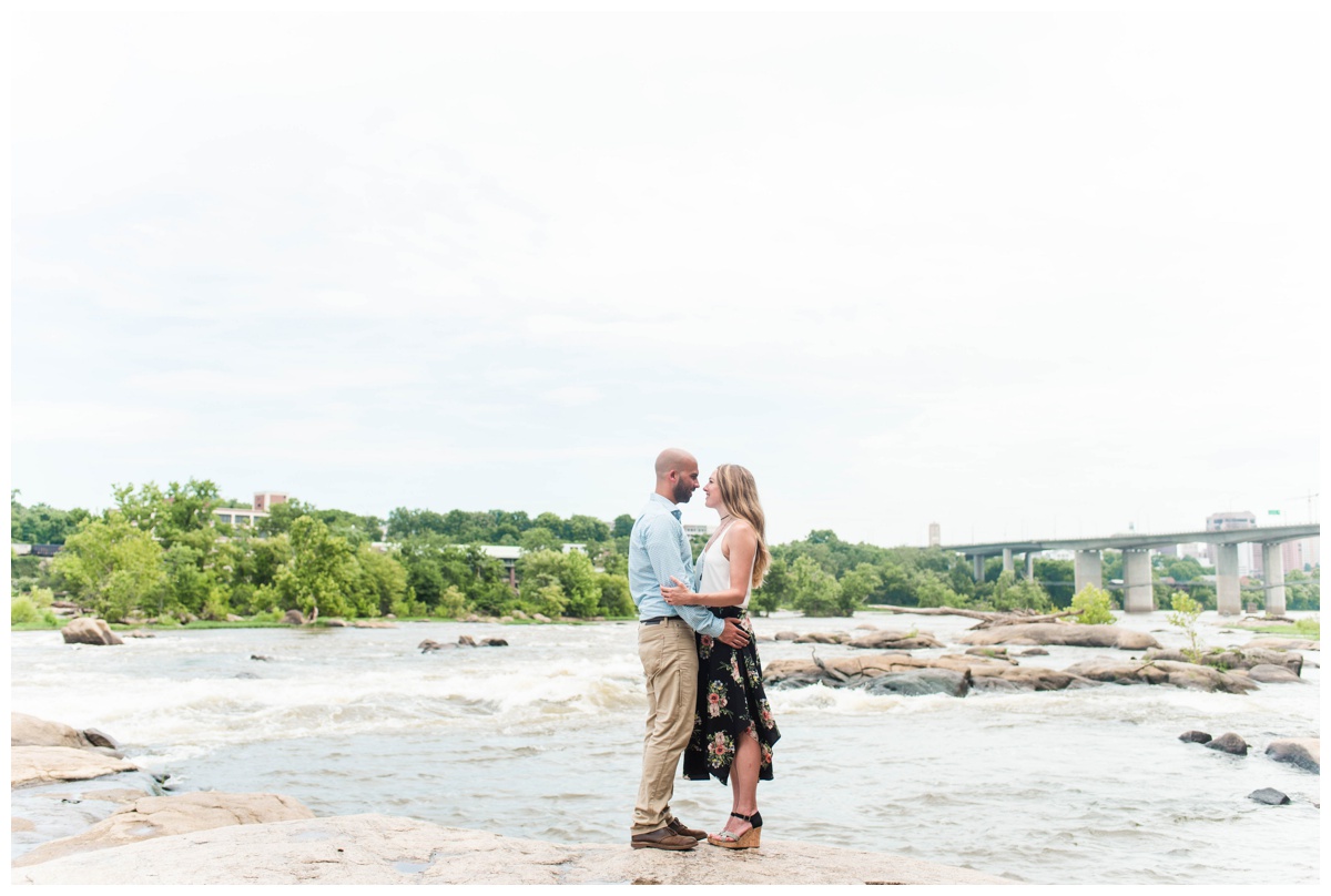 james river water views and green backdrop on a sunny day with richmond engagement photo session at belle isle by sarah & dave photography
