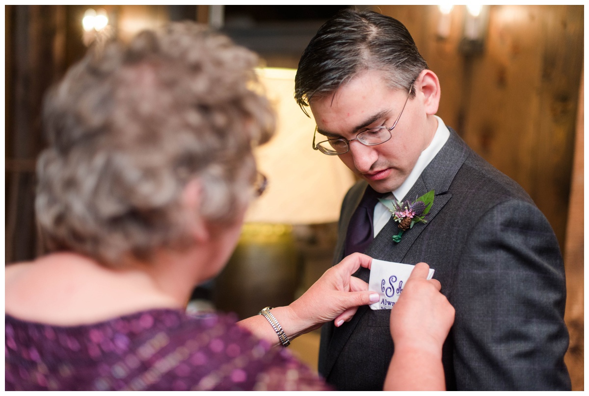 Whimsical Woodland Fall Wedding at mountain memories at thorpewood in thurmont maryland in october by sarah & dave photography richmond wedding photographer mother of groom helping groom fold pocket square getting ready photo ideas