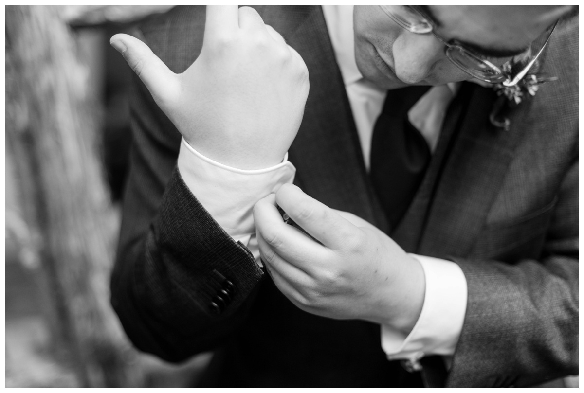 Whimsical Woodland Fall Wedding at mountain memories at thorpewood in thurmont maryland in october by sarah & dave photography richmond wedding photographer groom and groomsmen inspiration getting ready detail photo inspiration groom buttoning sleeves cufflinks