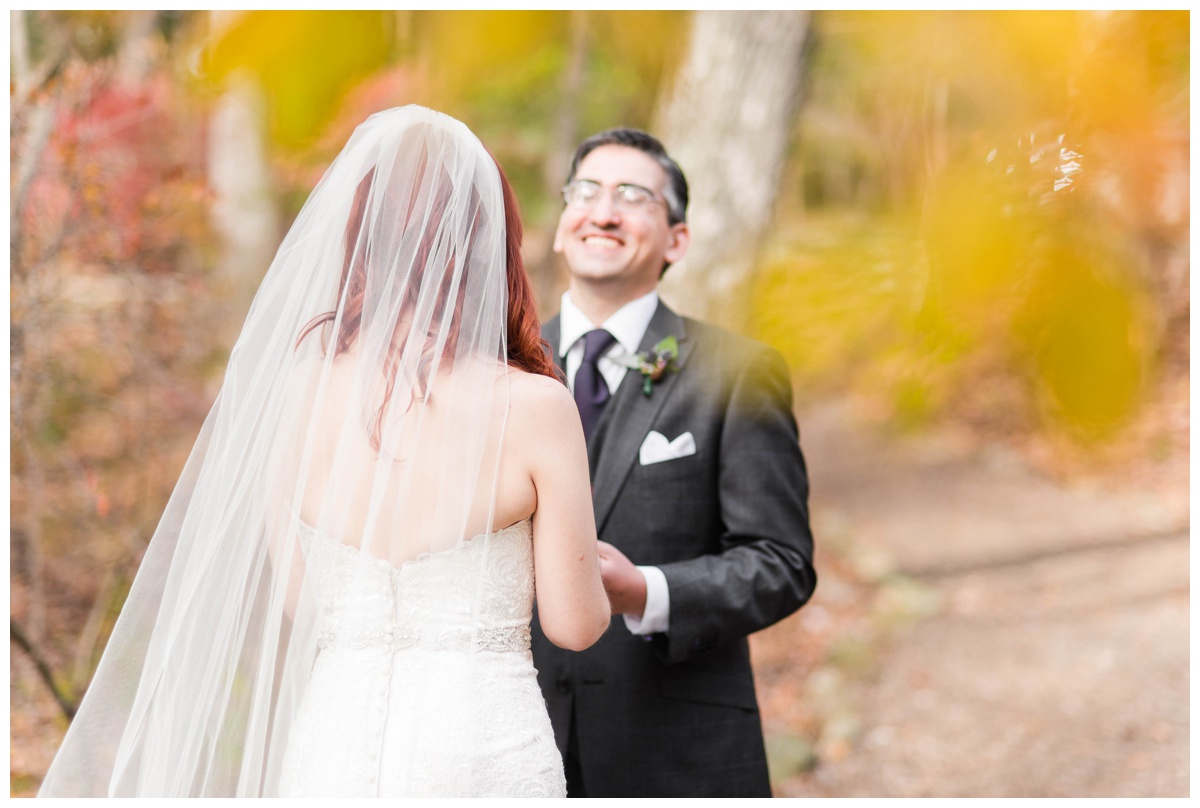 Whimsical Woodland Fall Wedding at mountain memories at thorpewood in thurmont maryland in october by sarah & dave photography richmond wedding photographer groom and bride first look photo inspiration purple tie charcoal gray black suit white wedding dress changing leaves surprised happy groom