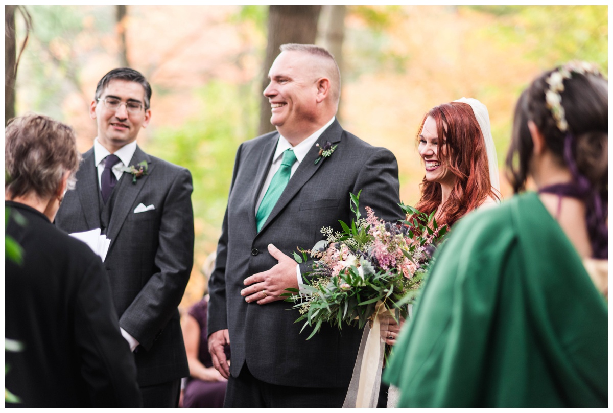 Whimsical Woodland Fall Wedding at mountain memories at thorpewood in thurmont maryland in october by sarah & dave photography richmond wedding photographer forest inspired outdoor ceremony in the woods father of the bride and bride at the altar