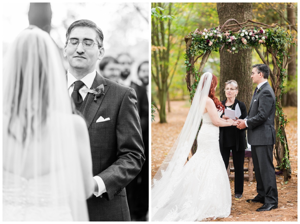Whimsical Woodland Fall Wedding at mountain memories at thorpewood in thurmont maryland in october by sarah & dave photography richmond wedding photographer forest inspired outdoor ceremony in the woods bride and groom at altar bride placing ring on finger saying vows tearful crying black and white photo