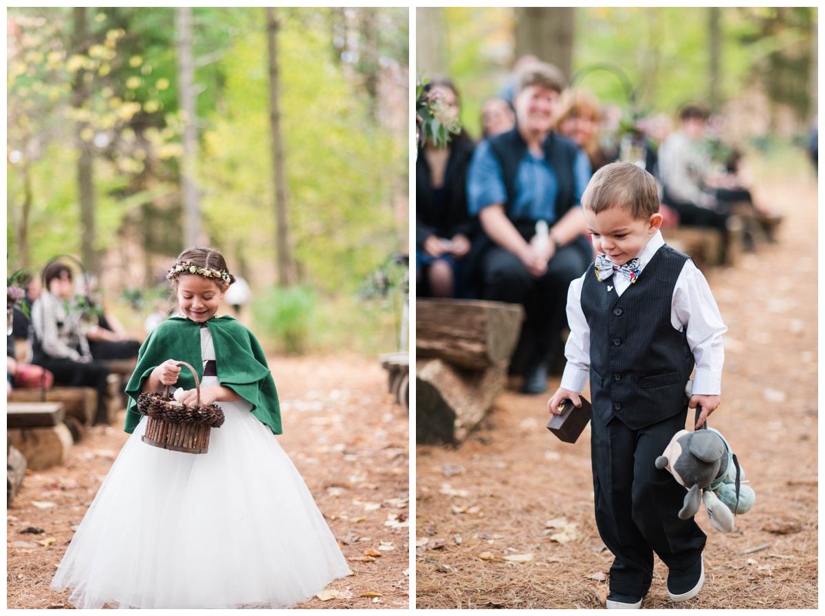 Whimsical Woodland Fall Wedding at mountain memories at thorpewood in thurmont maryland in october by sarah & dave photography richmond wedding photographer forest inspired outdoor ceremony in the woods ringbearer carrying lovey and small wooden box wearing charcoal black gray vest and suit pants button up shirt with tie