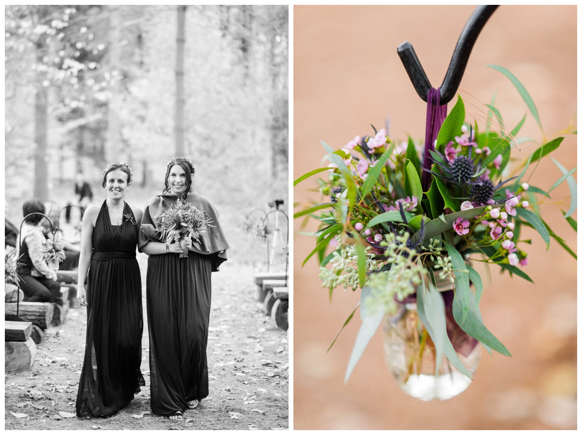 Whimsical Woodland Fall Wedding at mountain memories at thorpewood in thurmont maryland in october by sarah & dave photography richmond wedding photographer forest inspired outdoor ceremony in the woods bridesmaid and groomwoman walking down aisle log tree stump seating seats black dress deep dark purple bridesmaid dress with green cape bridesmaid cape fall wedding attire dress inspiration and flower arrangements in mason glasses budget friendly clear glass vase with purple ribbon thistle wedding flower 