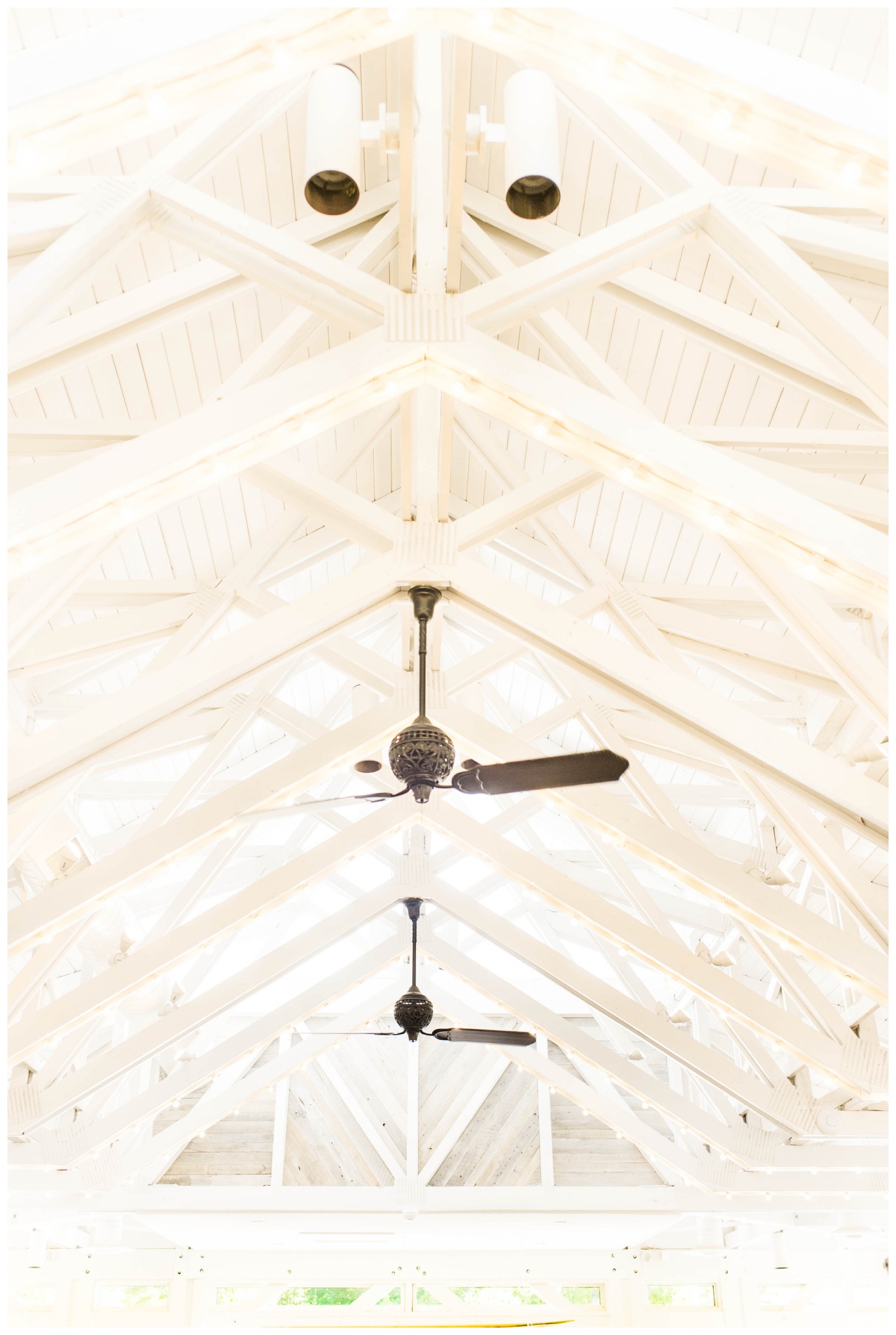 the boathouse at sunday park richmond virginia waterfront wedding venue outdoor wedding venue sailboats golden hour photo inspiration inside architecture white beams fans southern wedding venue by rva wedding photographer sarah & dave photography