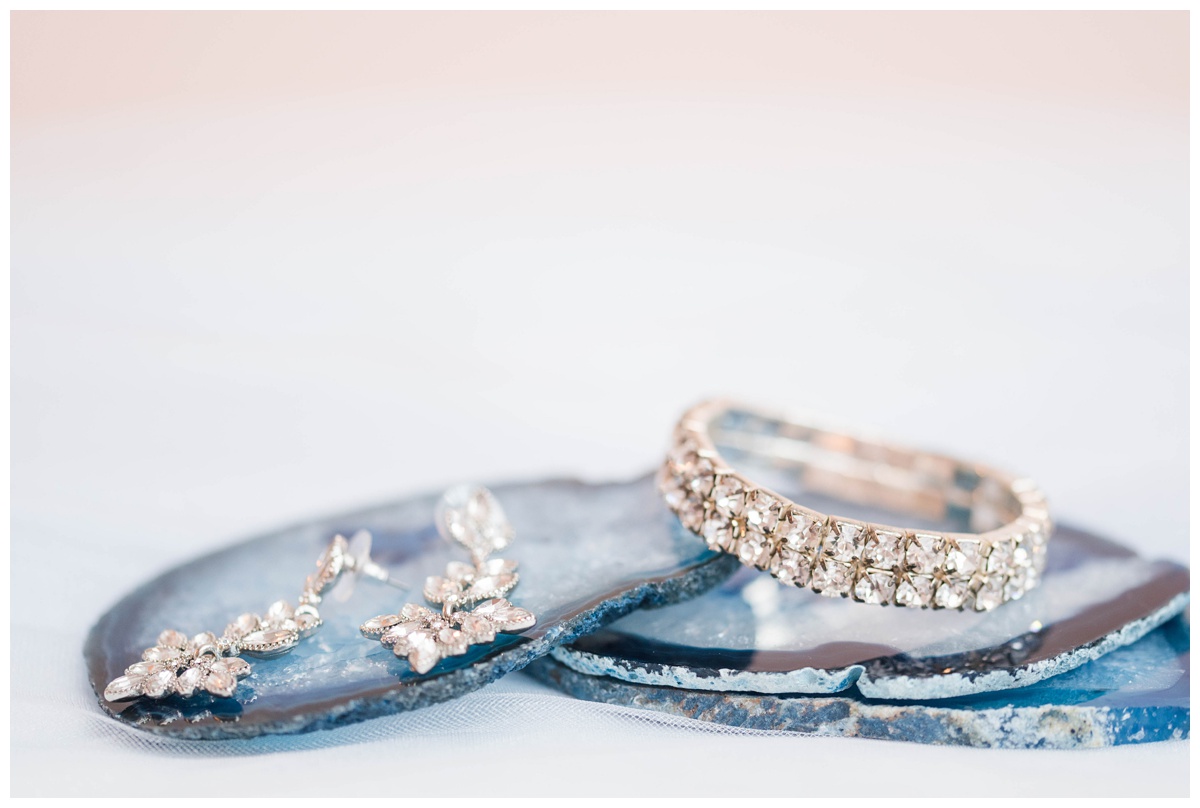 shades of blue wedding inspiration at quirk hotel in richmond virginia by rva wedding photographer sarah & dave photography bridal jewelry with blue geode display