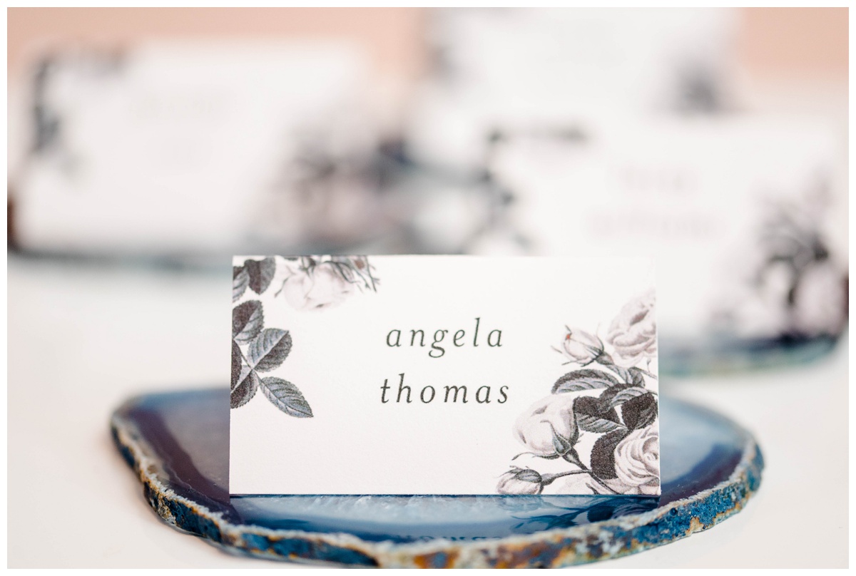 shades of blue wedding inspiration at quirk hotel in richmond virginia by rva wedding photographer sarah & dave photography name card escort card display ideas with geode and floral black and white name cards