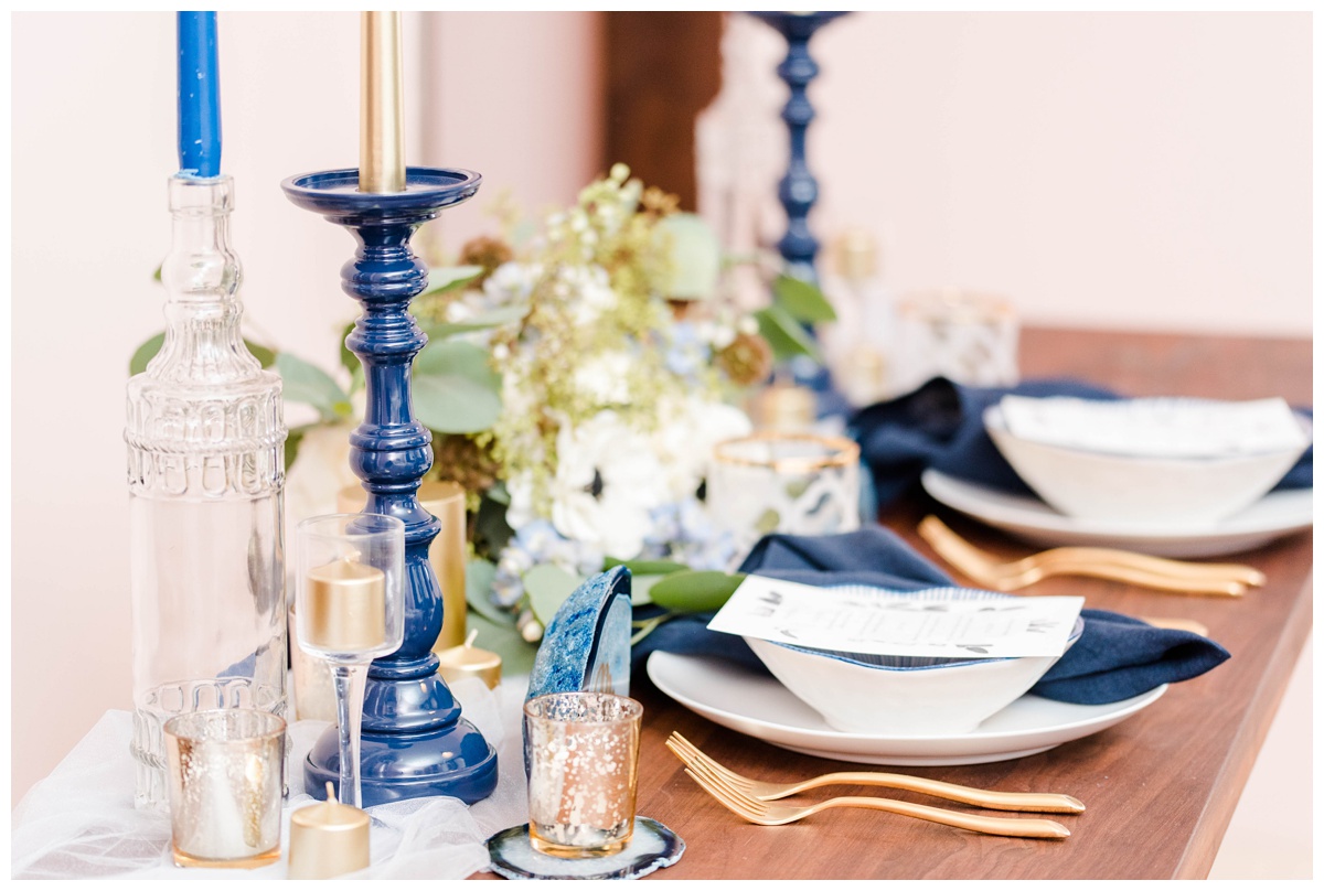 shades of blue wedding inspiration at quirk hotel in richmond virginia by rva wedding photographer sarah & dave photography blue wedding inspo ideas gold and blue modern wedding reception decor table setting inspo