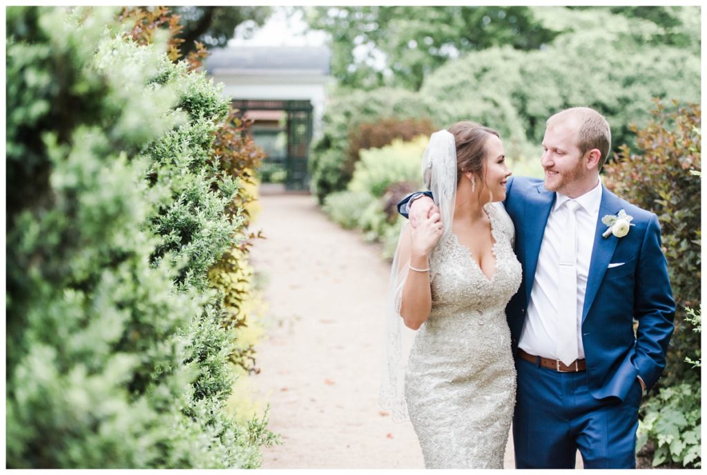 may wedding at oatlands historic house and gardens in the spring pink blue and silver wedding colors bride and groom smiling at each other by sarah and dave photography richmond wedding photographers formal portrait of couple