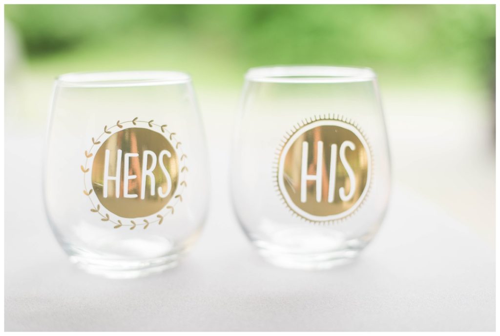 may wedding at oatlands historic house and gardens in the spring pink blue and silver wedding colors bride and groom smiling at each other by sarah and dave photography richmond wedding photographer personalized wine glasses 