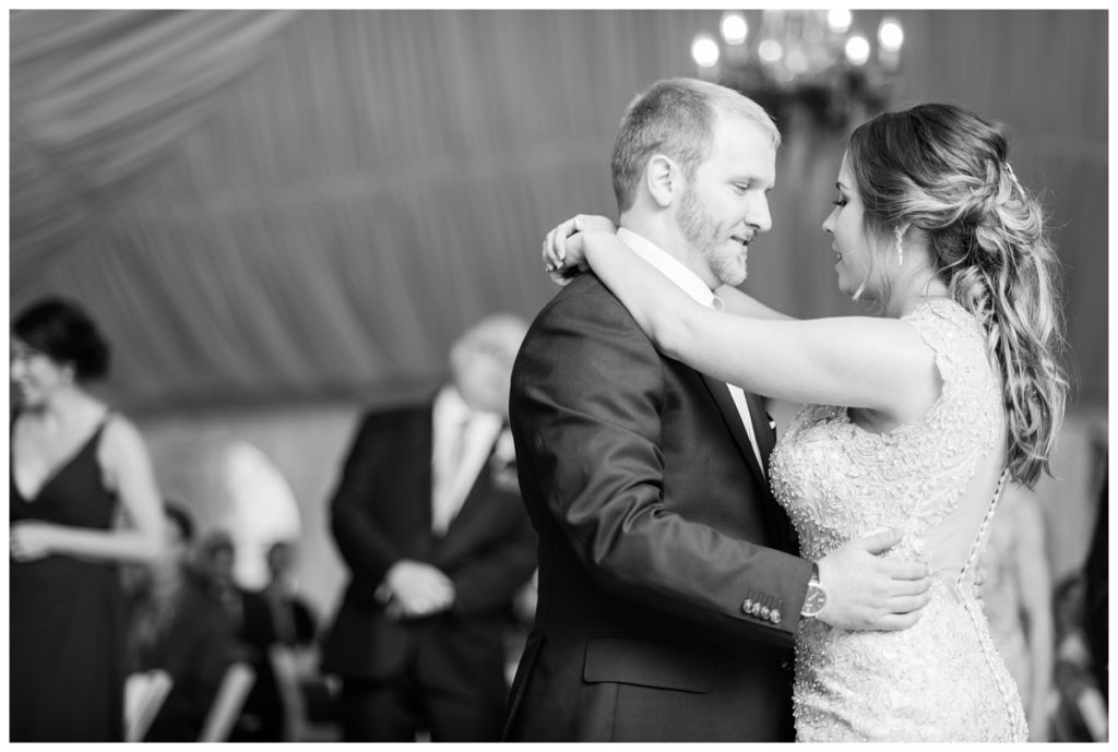 may wedding at oatlands historic house and gardens in the spring pink blue and silver wedding colors bride and groom smiling at each other by sarah and dave photography richmond wedding photographer bride and groom first dance