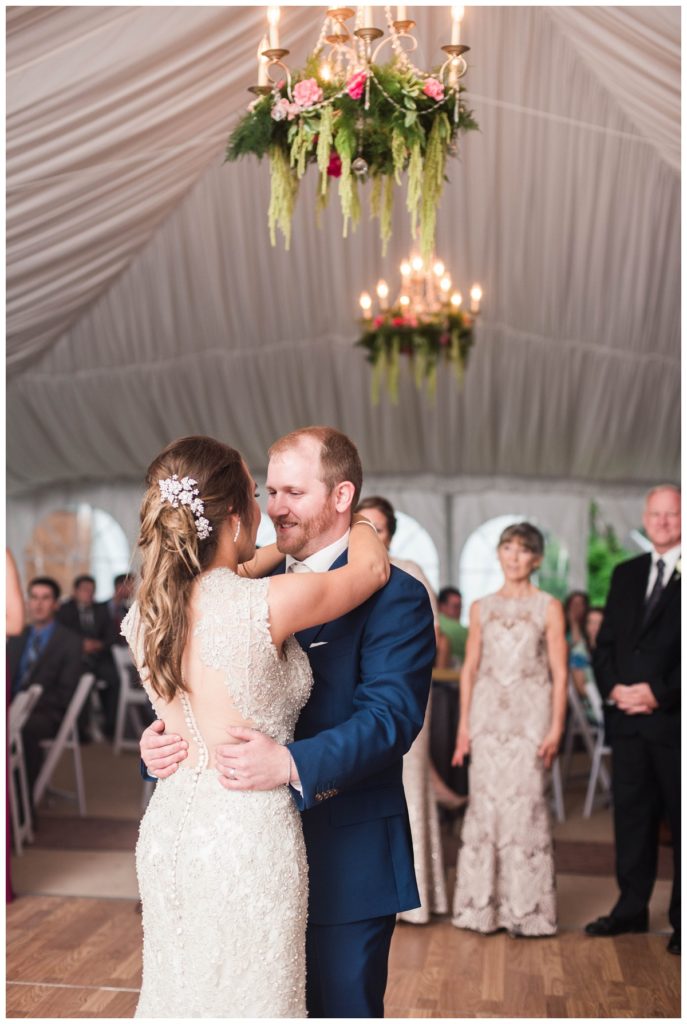 may wedding at oatlands historic house and gardens in the spring pink blue and silver wedding colors bride and groom smiling at each other by sarah and dave photography richmond wedding photographer bride and groom first dance 