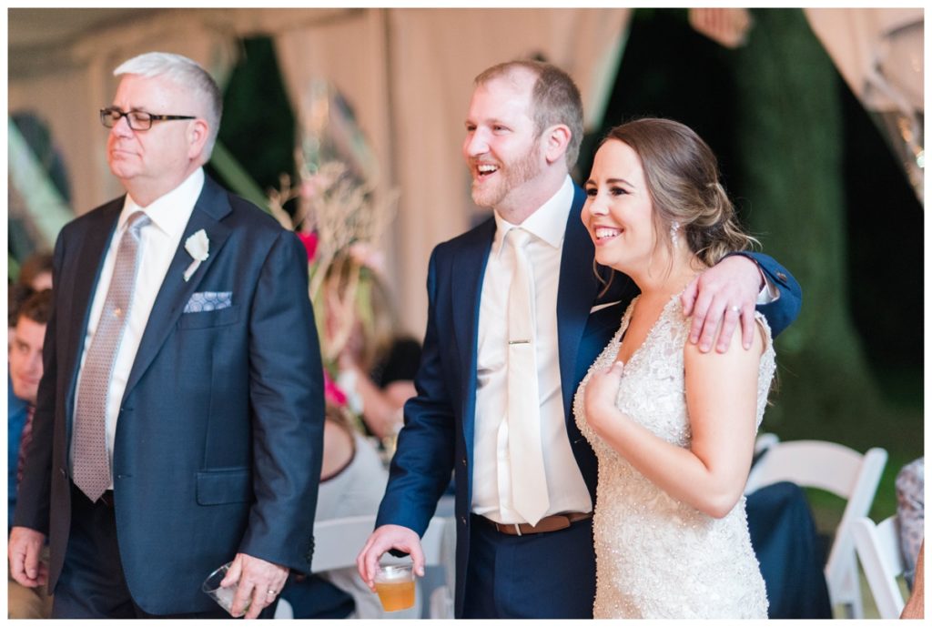 may wedding at oatlands historic house and gardens in the spring pink blue and silver wedding colors bride and groom smiling at each other by sarah and dave photography richmond wedding photographer couple smiling