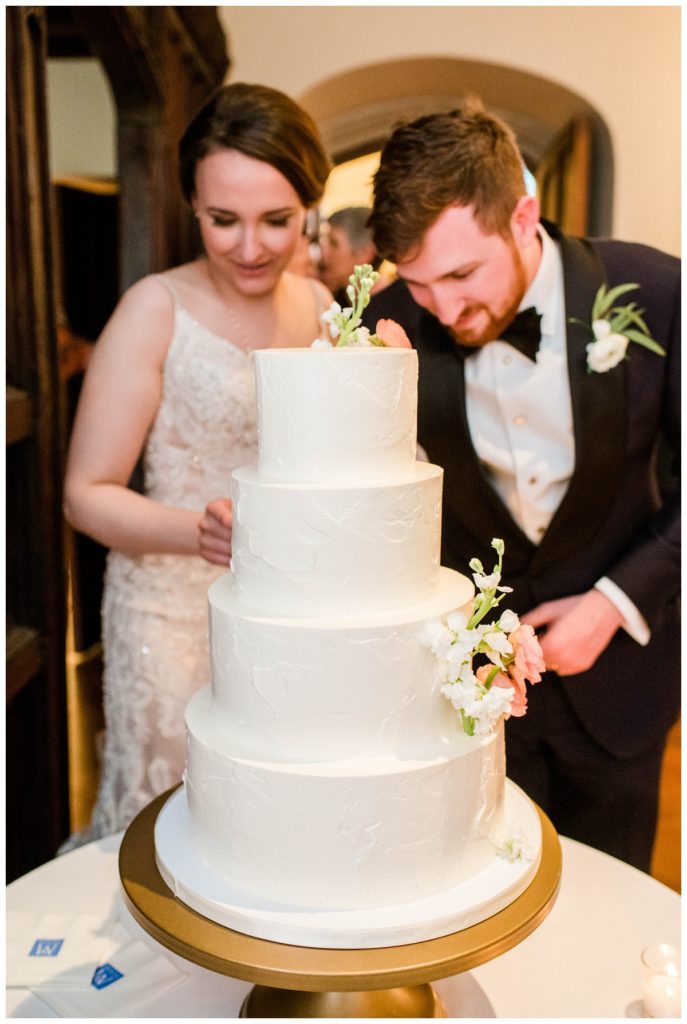 branch museum wedding in richmond va by rva wedding photographer sarah & dave photography cake cutting couple looking down