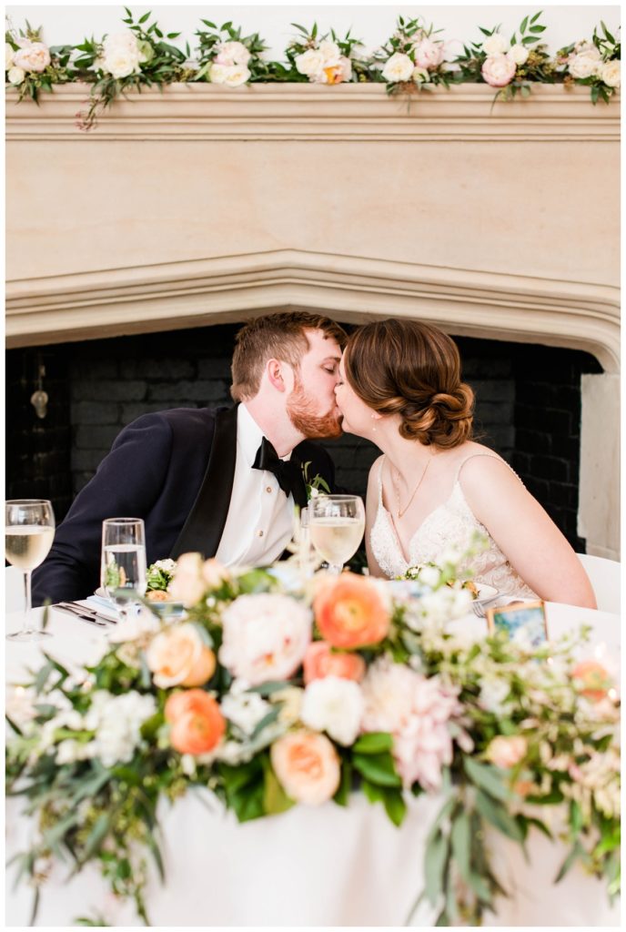 branch museum wedding in richmond va by rva wedding photographer sarah & dave photography couple kissing at sweetheart table