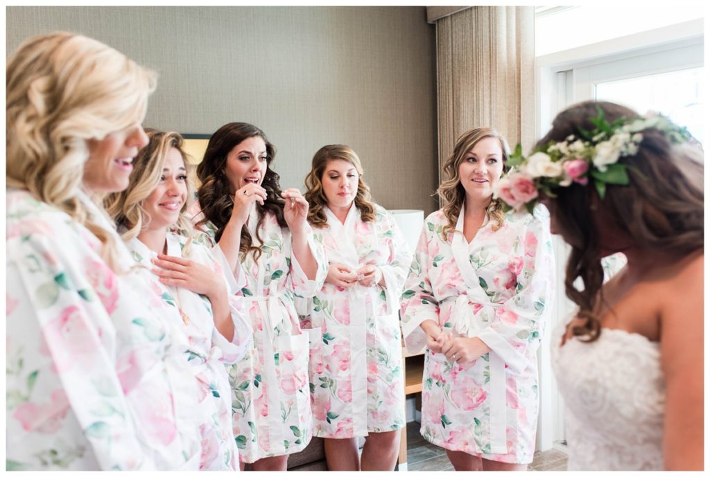 wedding party photo. first look with bride and bridesmaids. pink wedding inspiration and getting ready photo.