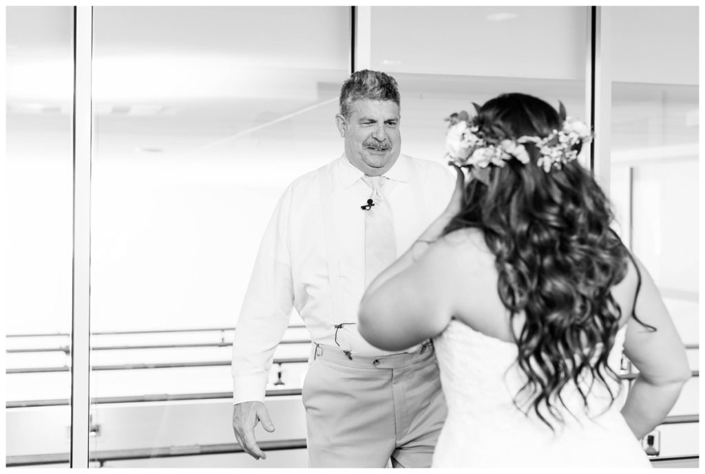 first look with bride and father. black and white photo in delaware hotel.