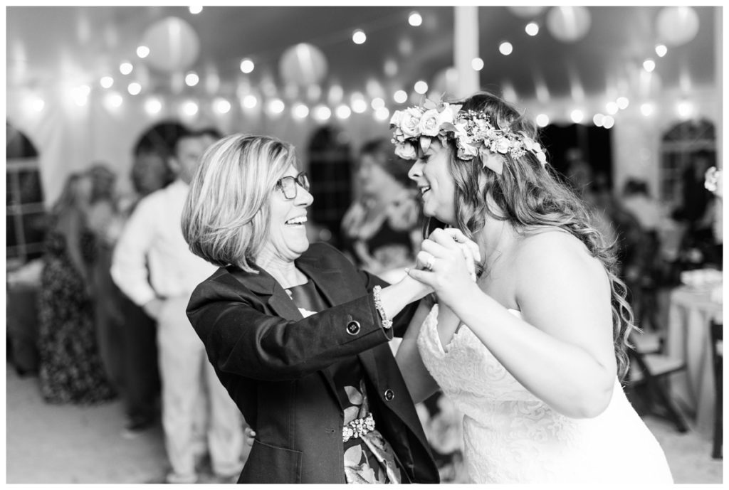 bride and mother in law dancing to music at delaware beach wedding venue