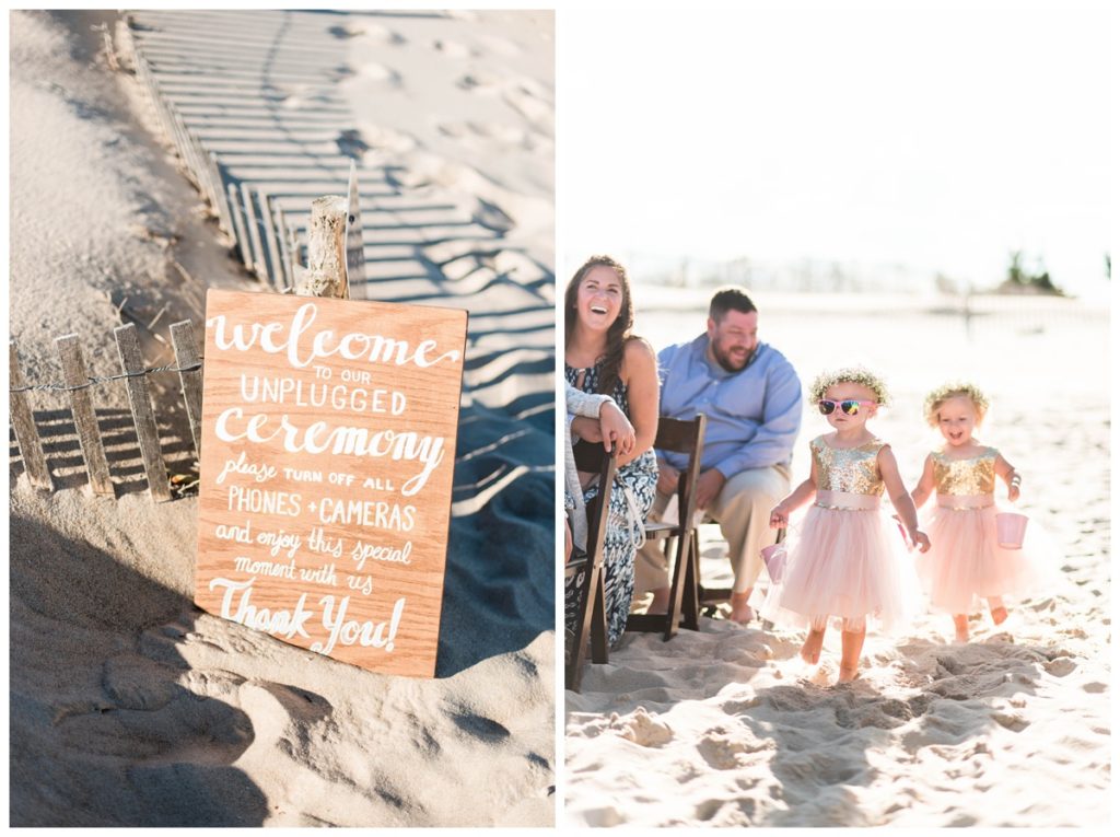 rustic and beach themed wedding in the late summer in september wooden unplugged ceremony sign and flower girls in pink tutus and gold dresses wearing pink sunglasses and flower crowns running down the sandy aisle at the beach in delaware. this romantic pink and gold beach wedding in the summer was absolute perfection. sunny wedding photos by sarah & dave photography, annapolis, dc, richmond, charlottesville, leesburg, and lynchburg wedding elopement proposal engagement and destination photographer