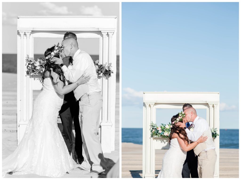 first kiss photos at this romantic delaware beach wedding with white arch and ocean backdrop. dreamy wedding photos by sarah & dave photography, virginia wedding photographer