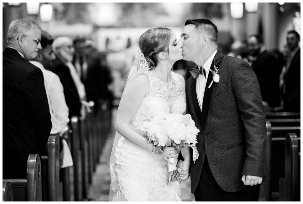 just married first kiss photo of couple in St. Joe's Villa Church in RVA