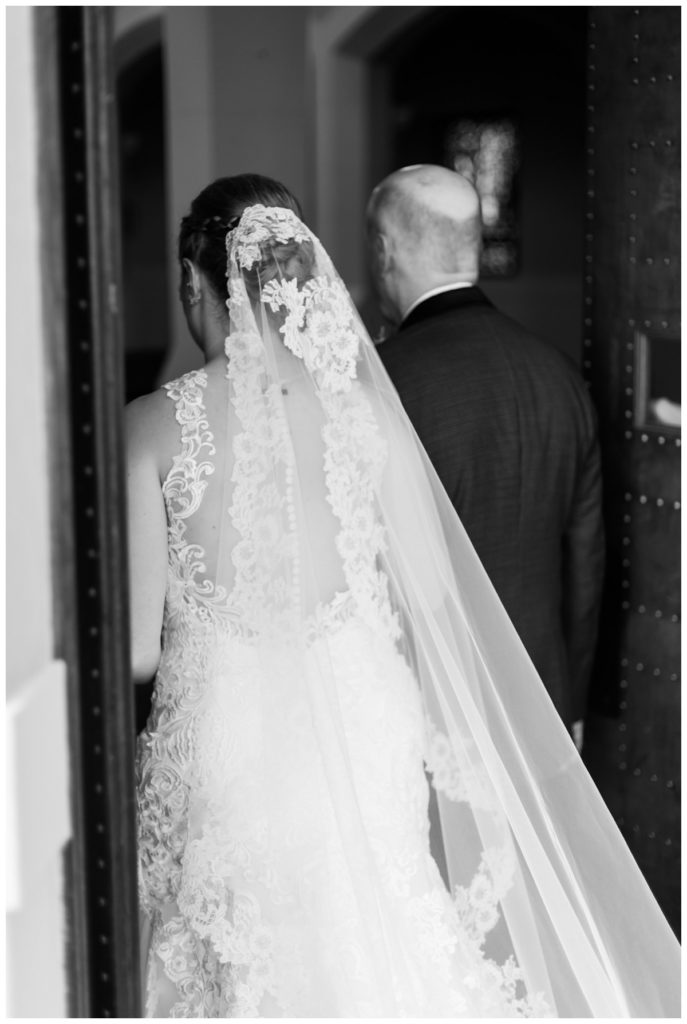 bride and father entering ceremony - photo of long veil with lace cathedral length