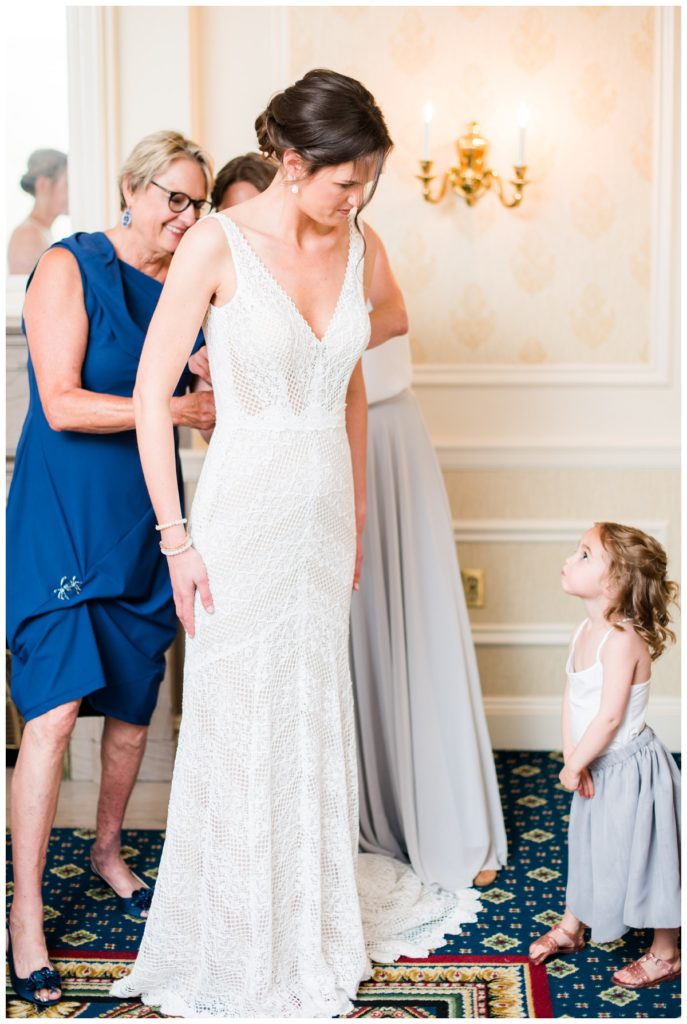 getting ready with bride, flower girl, mom, and bridesmaid at the jefferson hotel in richmond va. her little curls are so cute in this one.