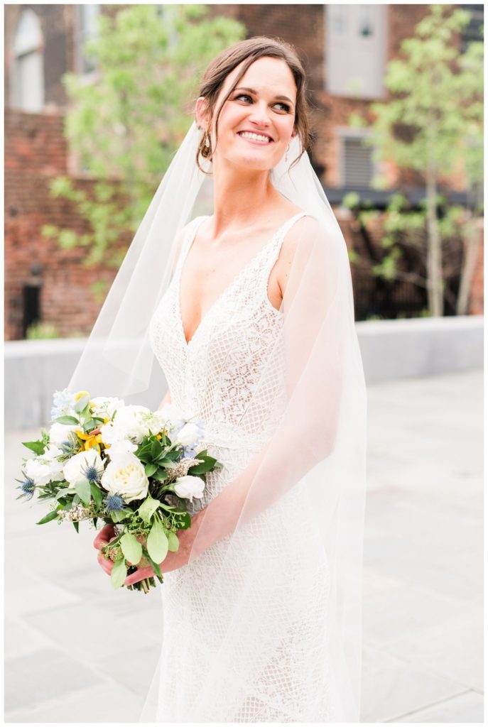 cute bridal portrait with kit just outside of the jefferson hotel in richmond virginia