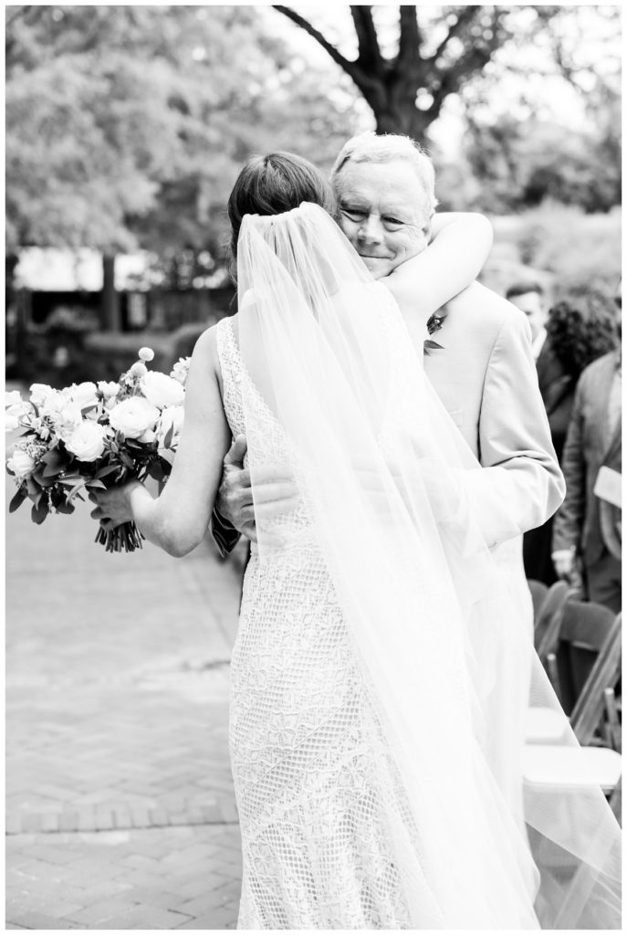 bride hugging father dad during ceremony - so sweet