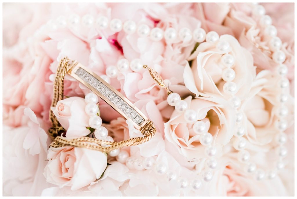 pink floral arrangement - bridal details photo shot - bridal bouquet - floral arrangements - light pink - jewelery