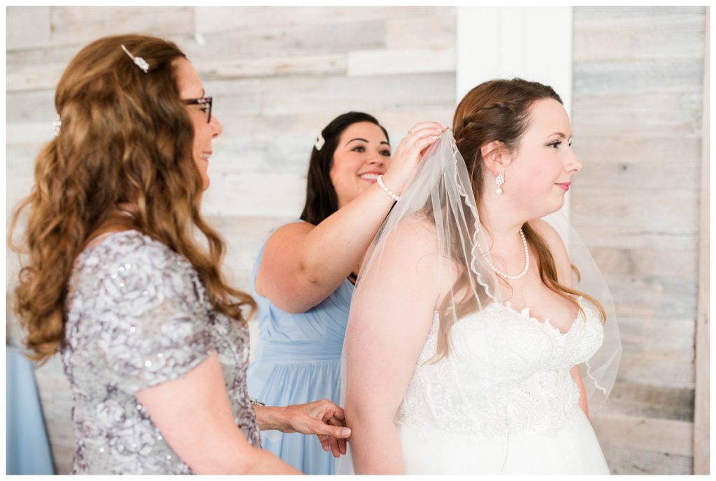 light blue bridesmaid dresses and bride - getting ready photo
