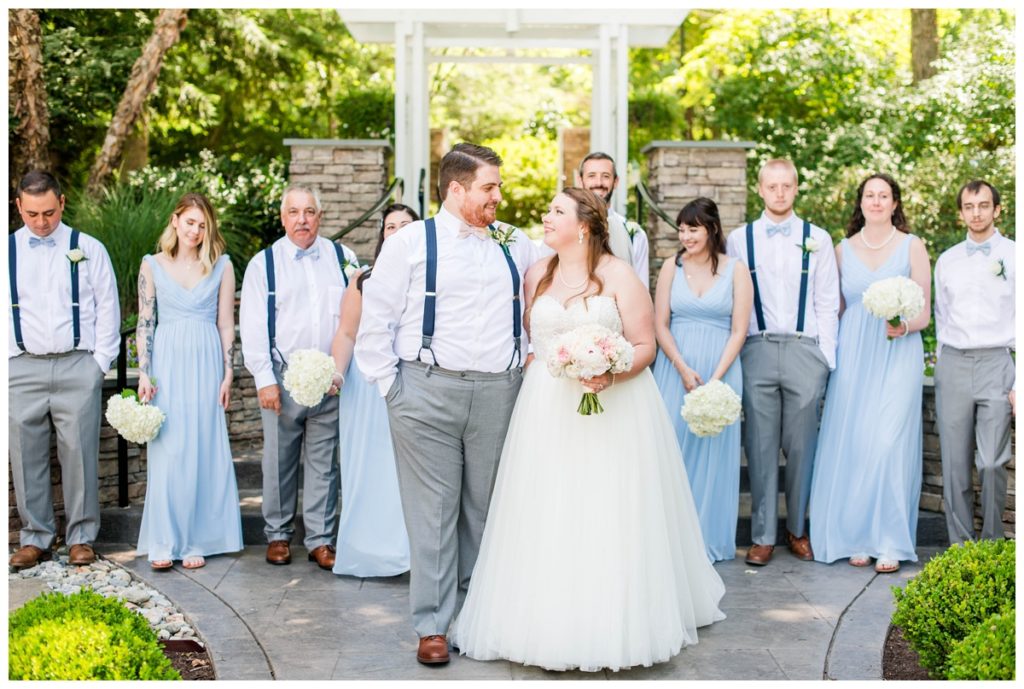 happy bride and groom walking - the boathouse at sunday park wedding in the summer - in june - fairy tale wedding inspired inspiration - light blue bridesmaid dresses - by richmond wedding photographer, sarah & dave photography