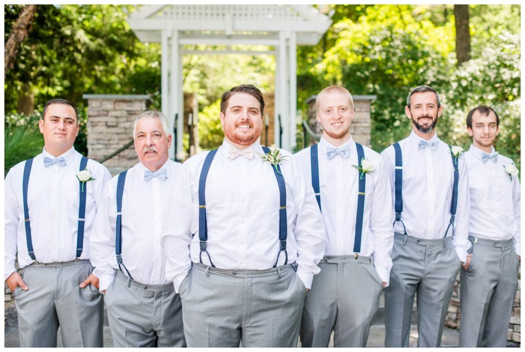 groom and wedding party groomsmen photo - light grey gray suit pants, navy blue suspenders, and bowtie at rva wedding venue the boathouse at sunday park by sarah & dave photography, rva wedding photographer