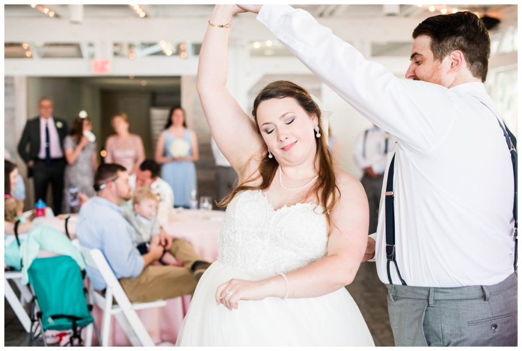 bride and groom dancing - couple dancing - eyes closed - twirl - wedding reception - first dance
