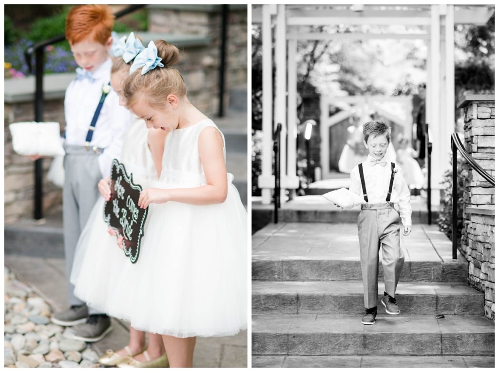 cute kids - smiling flower girls carrying chalk sign at wedding and red haired ringbearer wearing suspenders and little suit pants in gray and navy