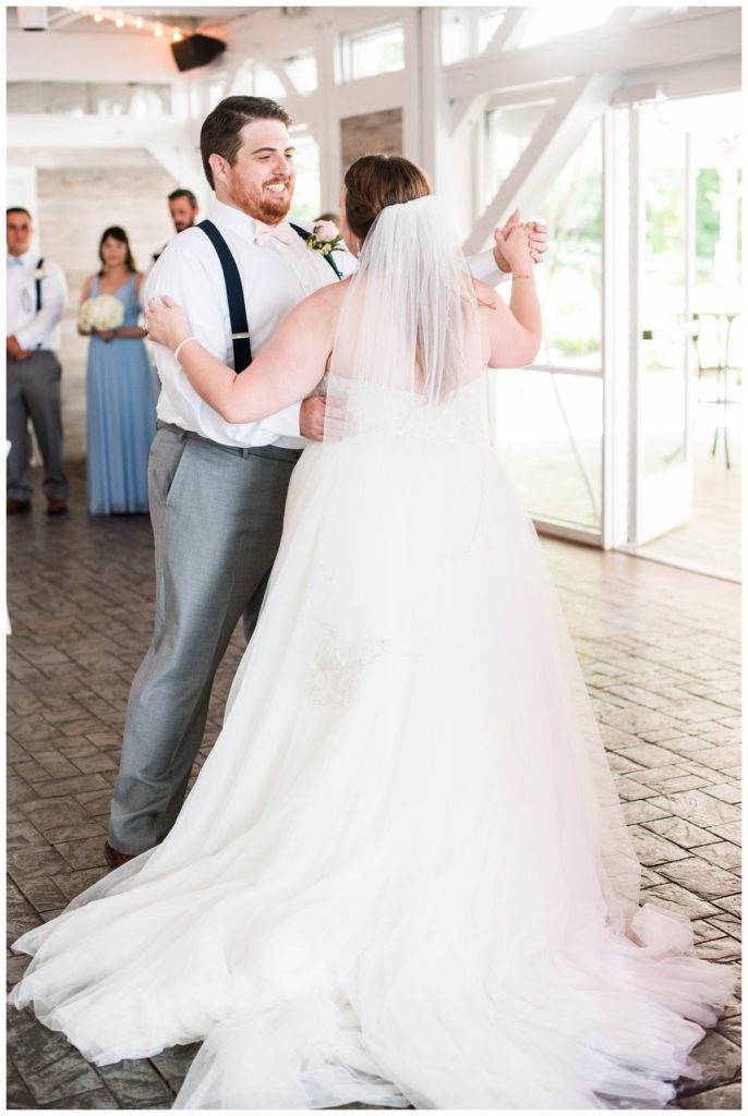 bride and groom dancing - first dance at wedding reception photo