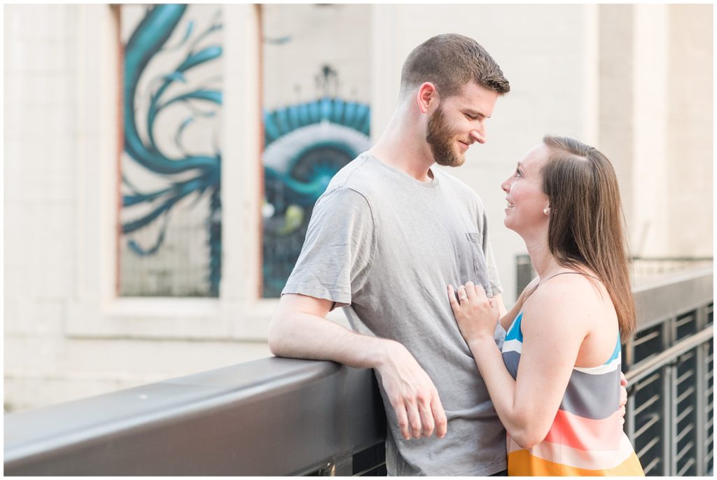 may engagement photos in richmond rva virginia in the spring by richmond wedding photographer. outdoors with street art and bridge.