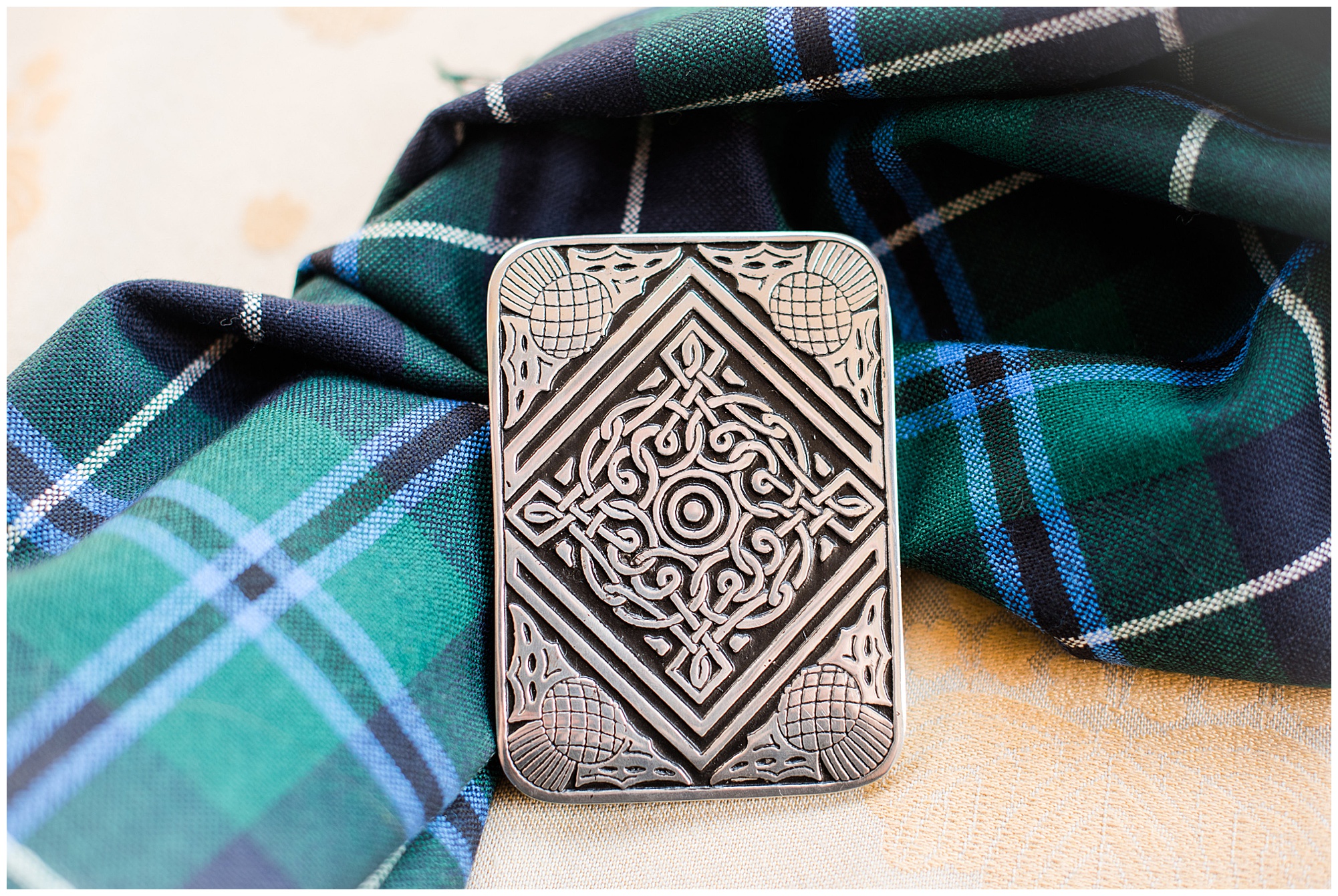 tartan and scottish pin details. groom getting ready photo by richmond wedding photographer, sarah & dave photography