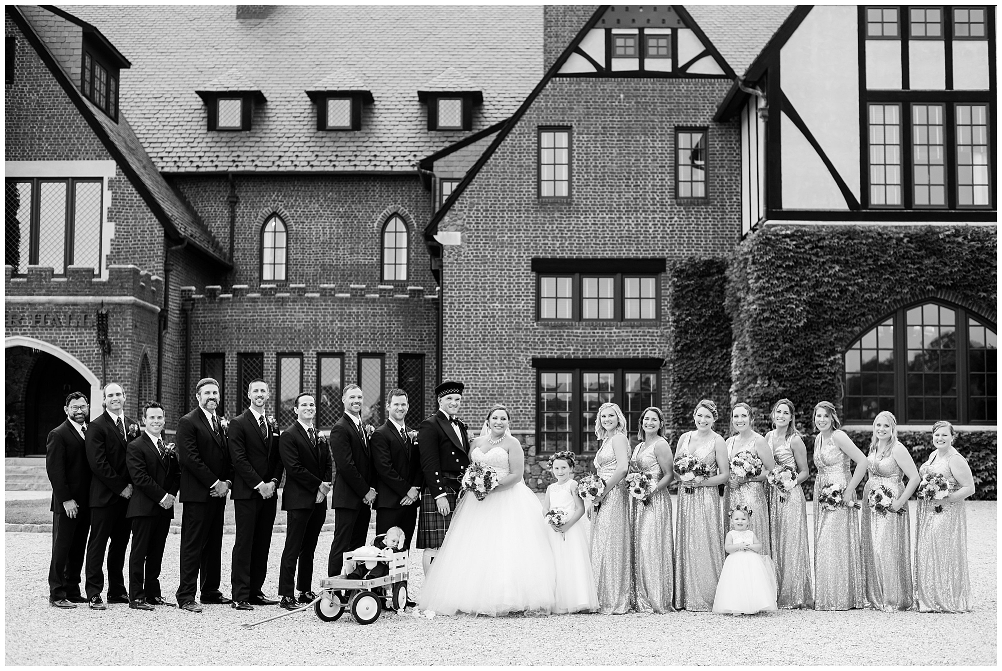 photo of wedding party. dover hall estate venue is in the backdrop. fall wedding in rva in september. 