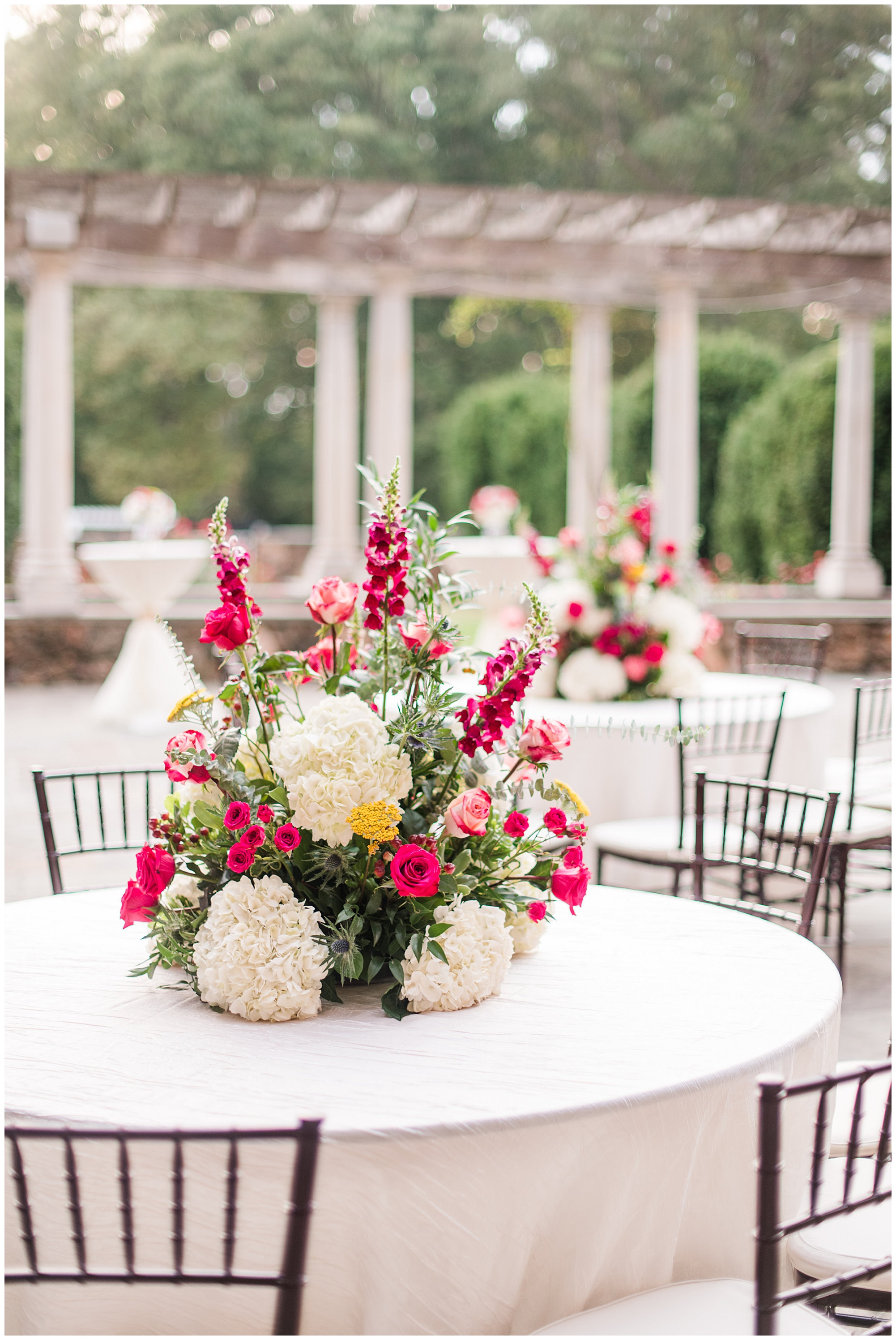 dover hall estate richmond venue outdoors at reception in the fall in september and colorful yellow and pink flower arrangement table setting and centerpiece