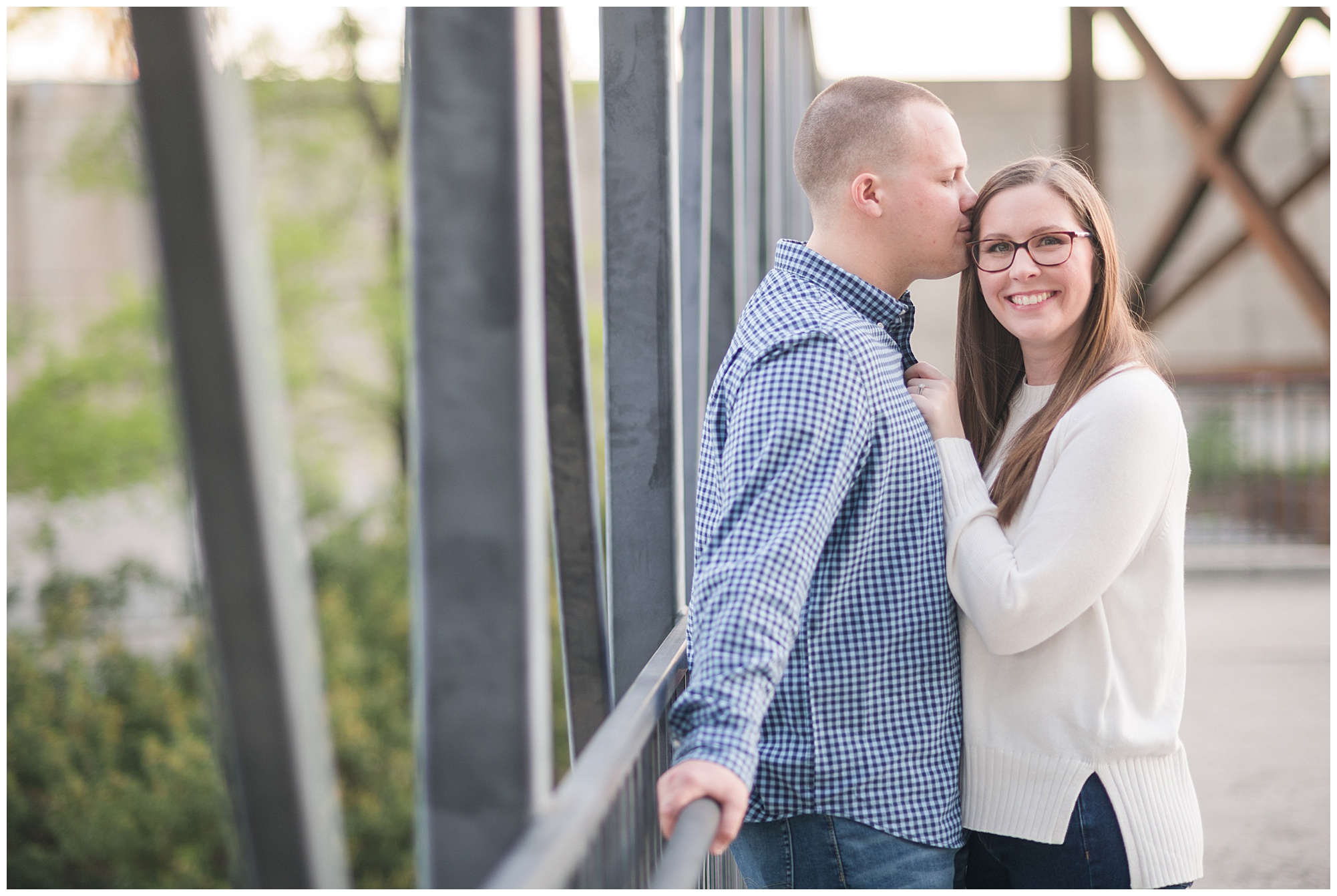 bride and groom on richmond footbridge. engagement photos in the spring, april. by richmond wedding photographer, Sarah & Dave Photography