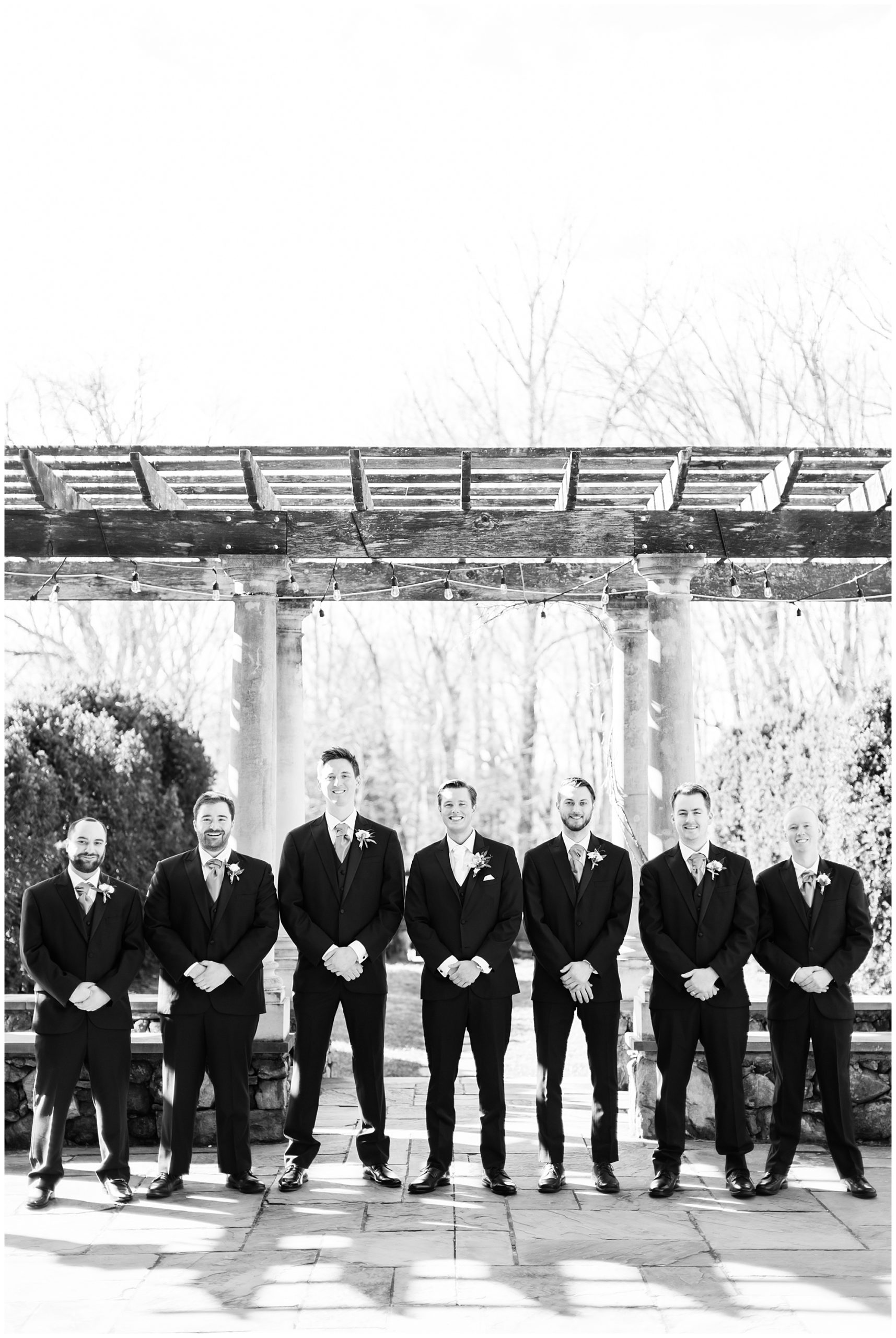 groom and wedding party outdoors at dover hall estate for january wedding. by richmond rva wedding photographer, sarah & dave photography.